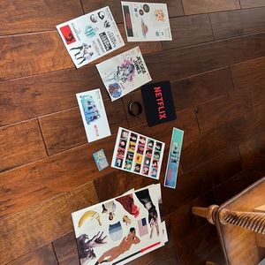 Netflix tech stickers, bracelet, mousepad, and comic book